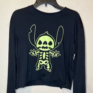 Black crop top with Stitch’s anatomy. Has “Stitch” written across right hand